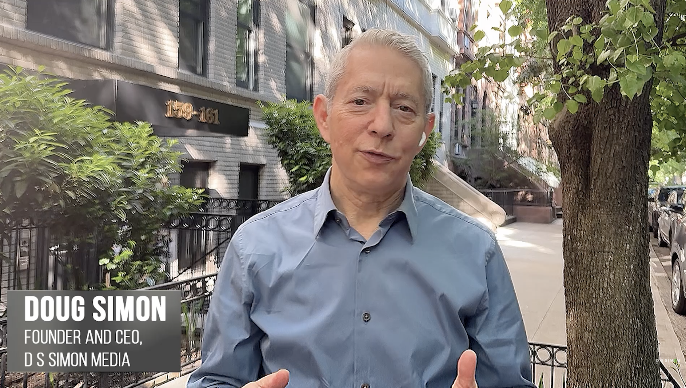 Doug Simon standing outside the Manhattan building where he founded D S Simon Media