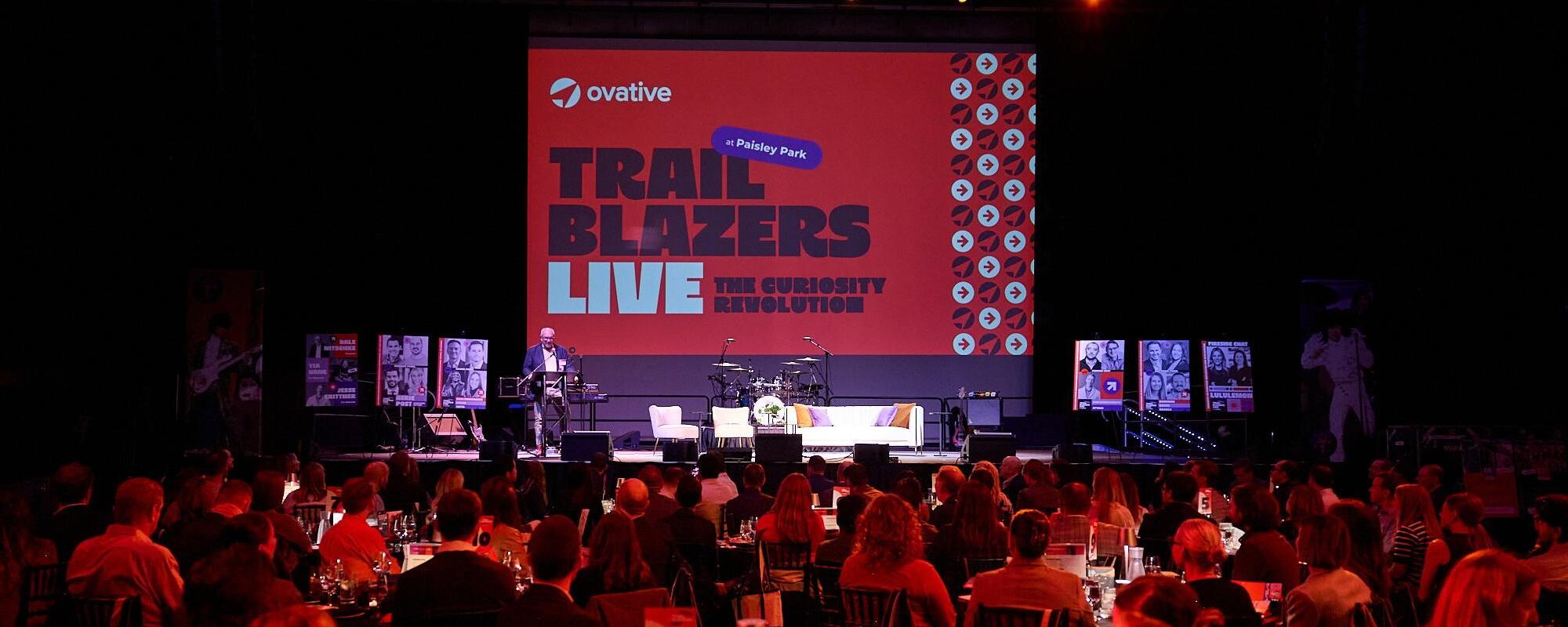 Dale Nitschke speaking onstage at Ovative's Trailblazers Live event at Paisley Park