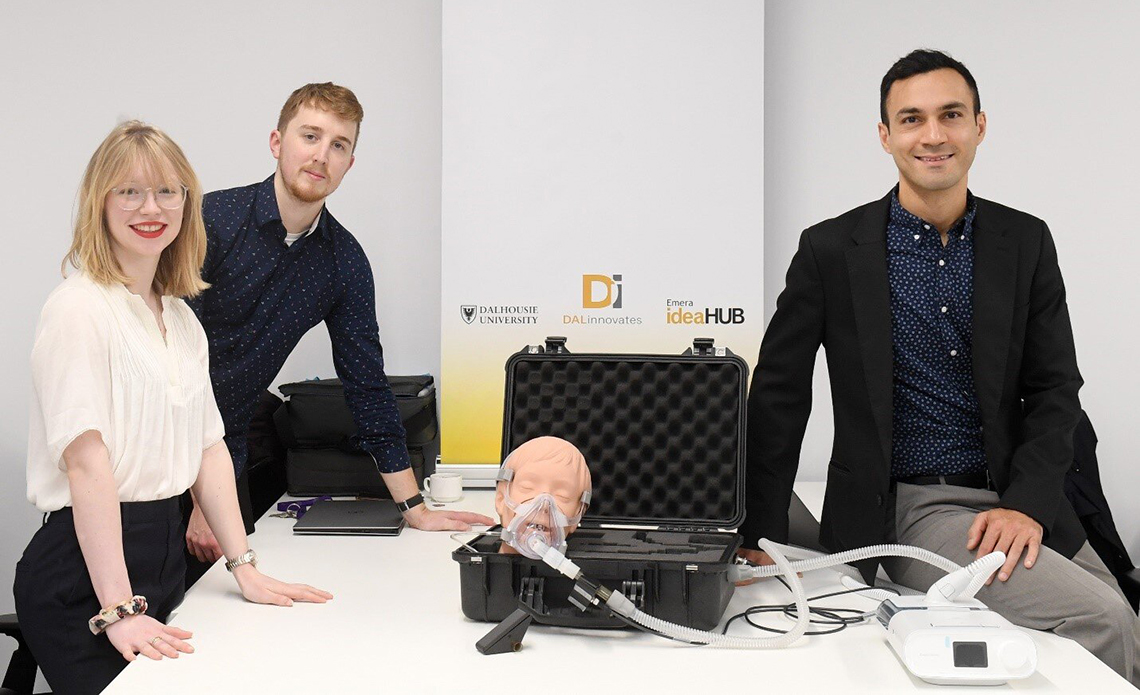 NovaResp team members with a respiratory-device demonstration and mannequin