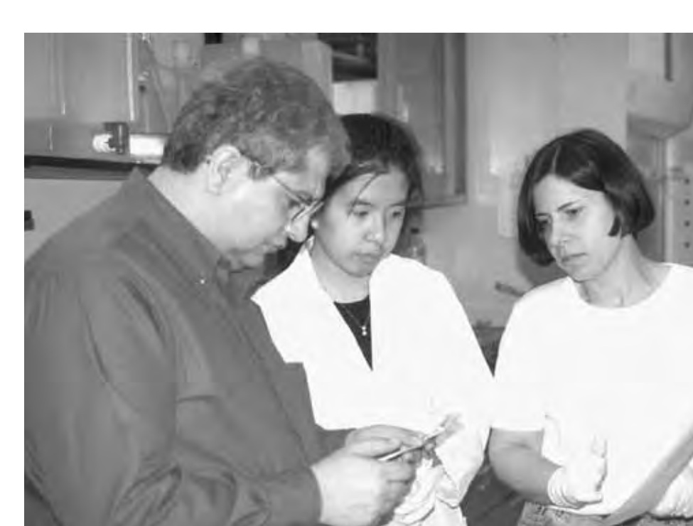 Dalia Alfi, at right, with Mansour Samadpour and Nora Su-In Chen in a University of Washington molecular epidemiology laboratory in the late 1990s
