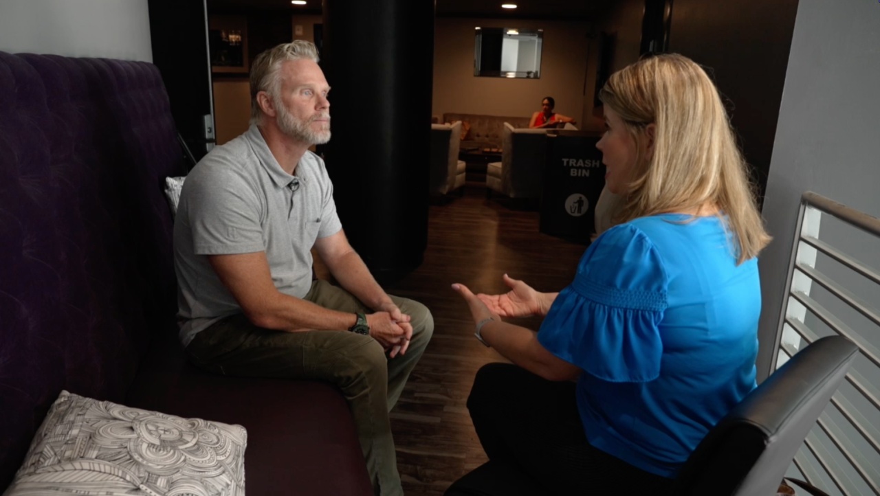 Damian Creamer seated opposite reporter Melissa Blasius during an interview about Primavera Online School