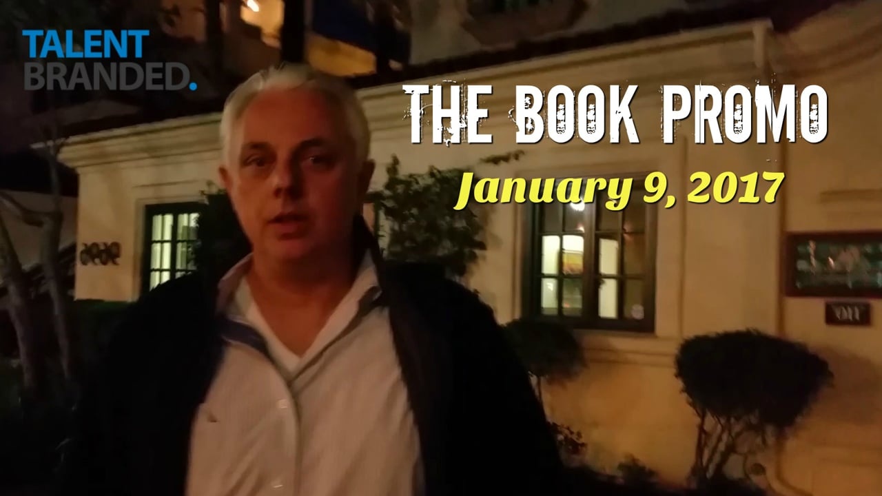 Damon Frank outside a building in the title frame of his January 9, 2017 book-promotion video