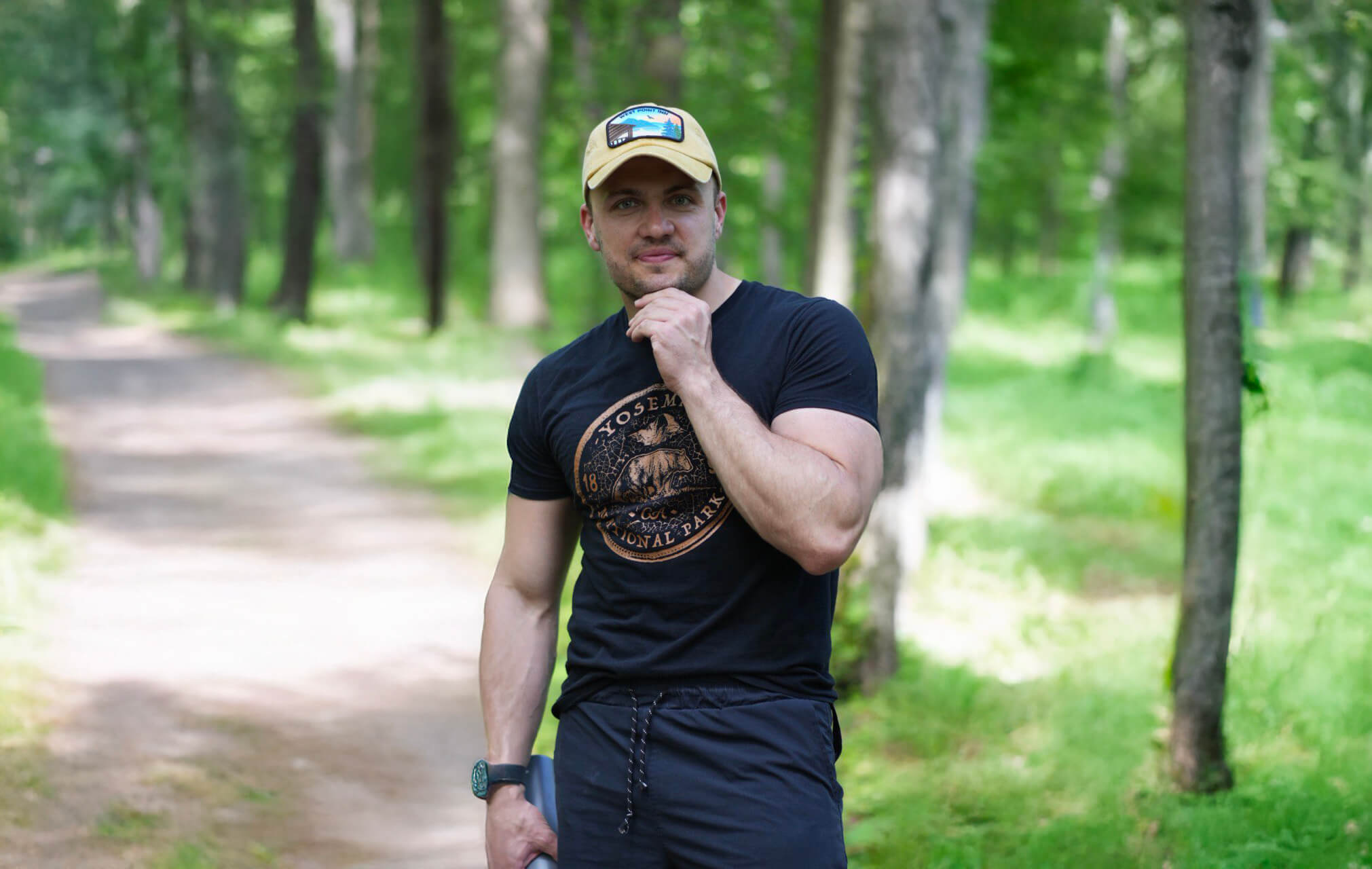 Dan Mishin outdoors on a wooded trail