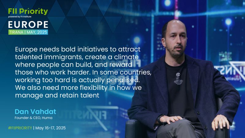 Dan Vahdat seated at FII Priority Europe in Tirana, with remarks about attracting talent displayed beside him