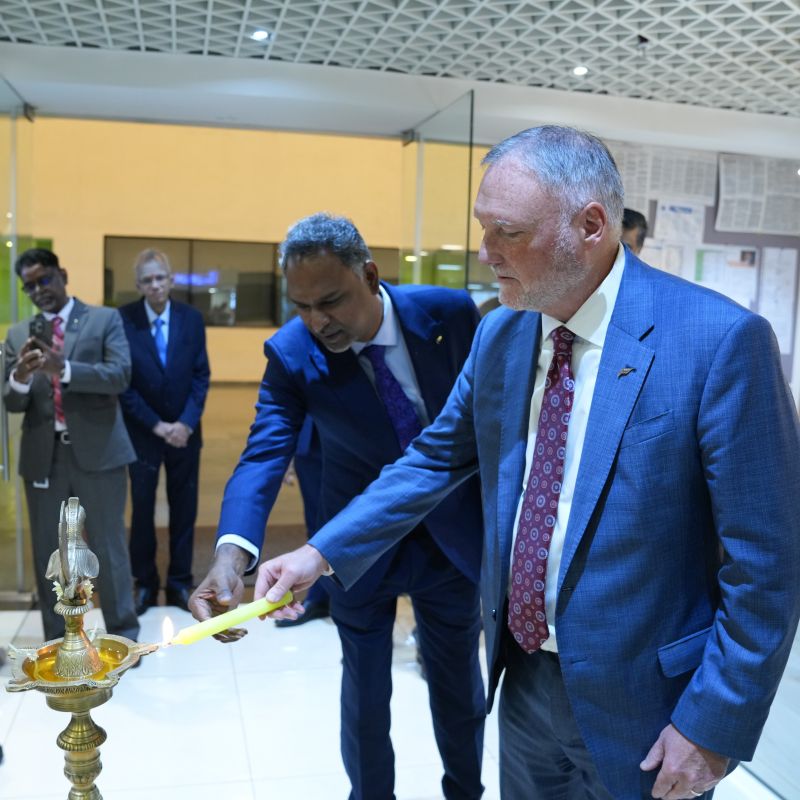 Dan Wall joins a lamp-lighting ceremony during his visit to the Chennai office.