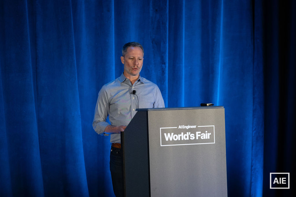 Daniel Chalef speaking at the lectern at AI Engineer World's Fair 2026
