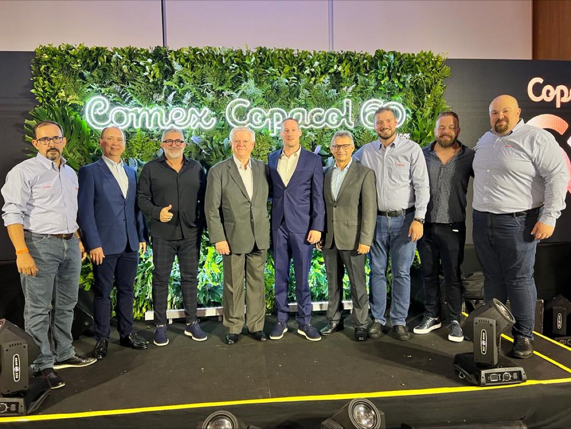 Daniel Ellman at the centre of a group at Copacol’s 60th-anniversary celebration in Brazil