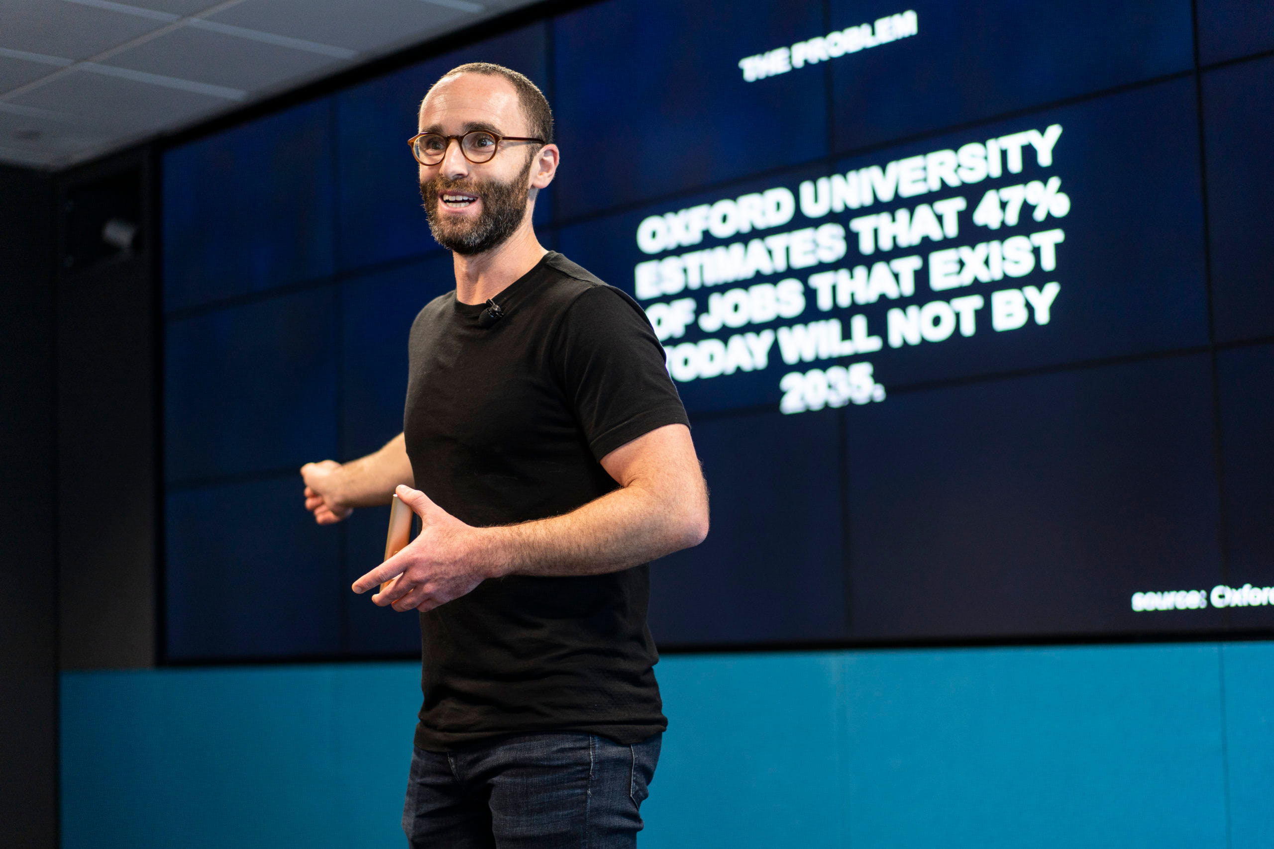 Daniel Epstein gesturing during a presentation