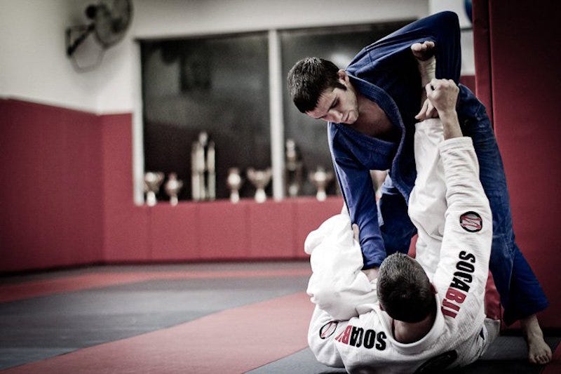 Daniel Faggella practicing Brazilian jiu-jitsu with a training partner