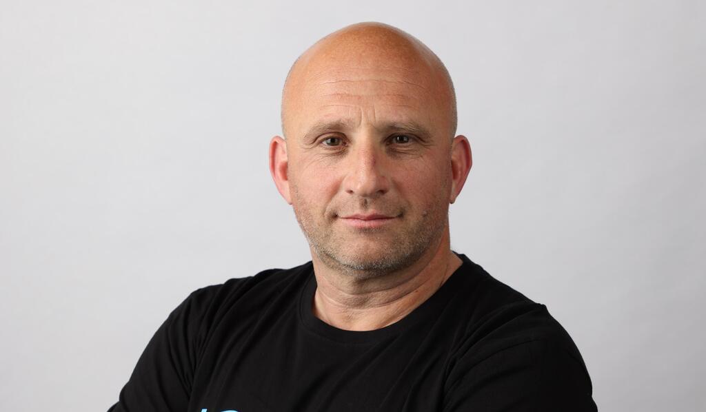 Daniel Shaked in a black T-shirt in a press photograph published in 2022