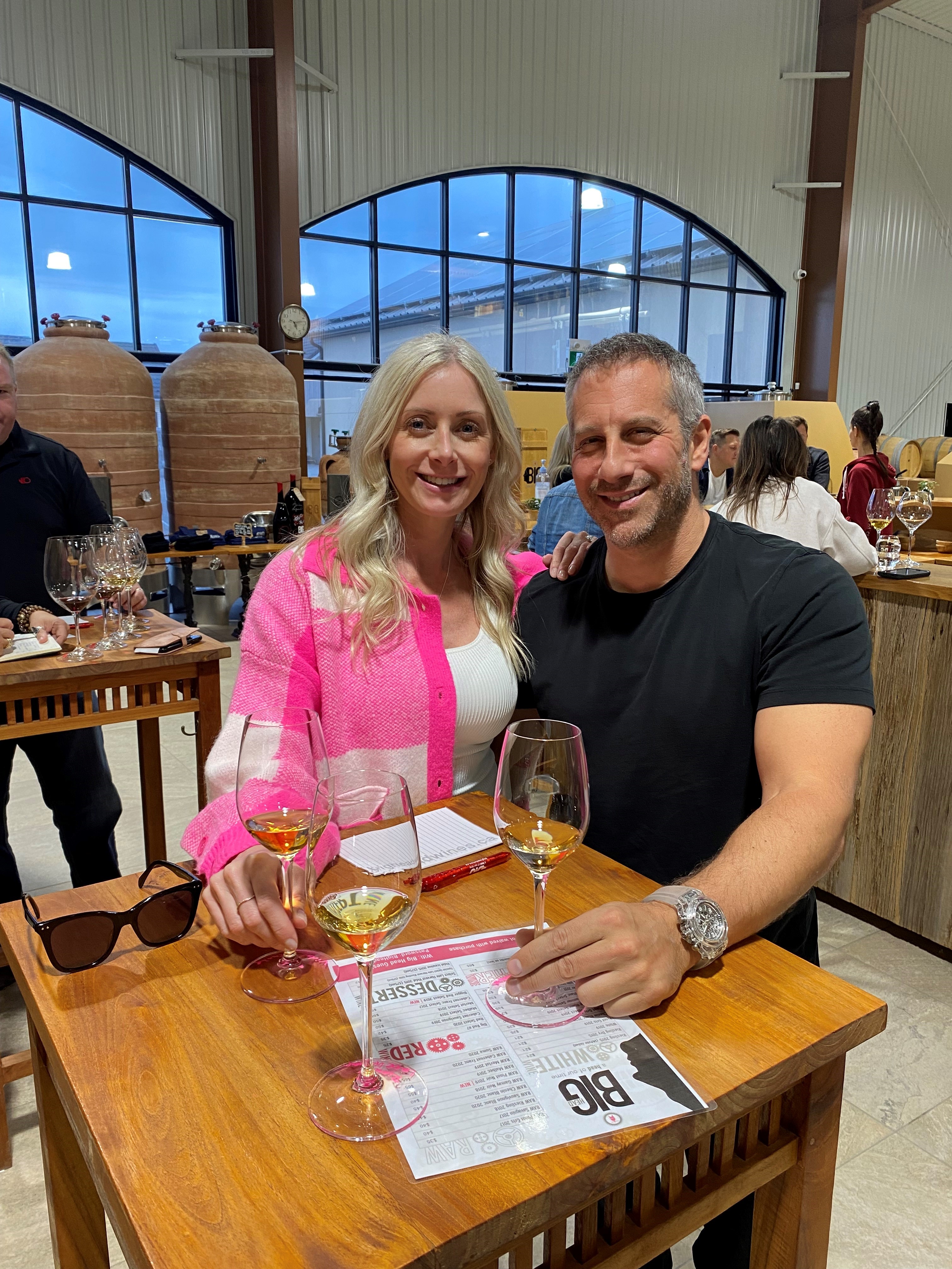 Dan Shimmerman and his partner Lori seated together at a Niagara winery