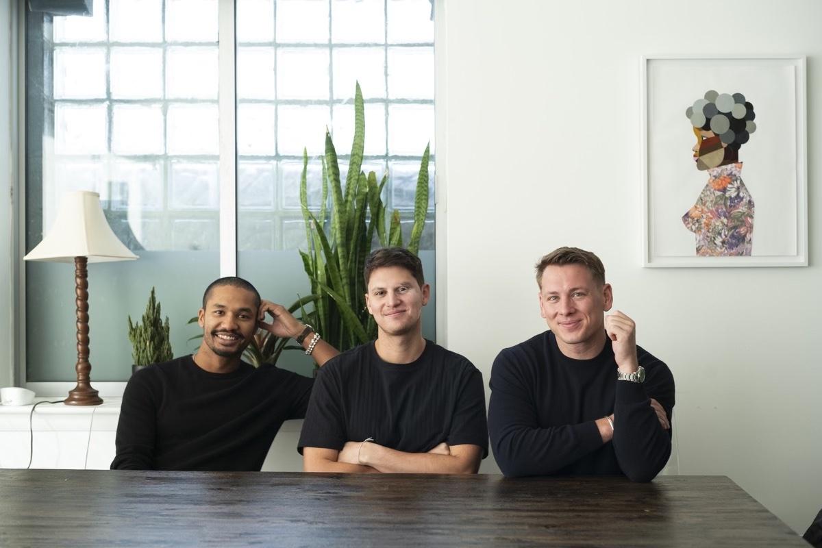Bags founders Daniel Taylor, Ignacio Semerene and William Hayden seated together at an office table