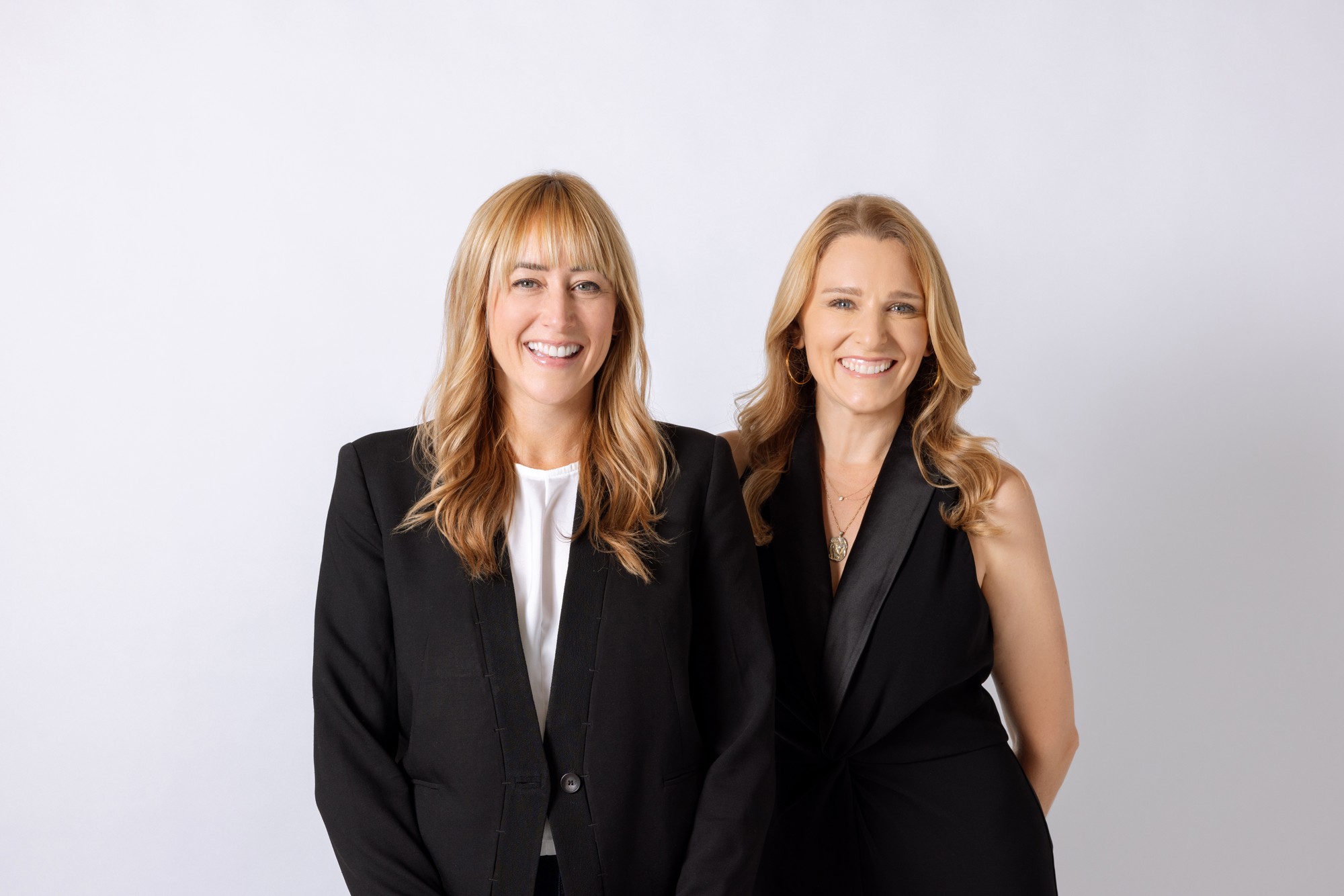Danielle Finck on the left and Silvie Snow-Thomas on the right, smiling in a joint portrait