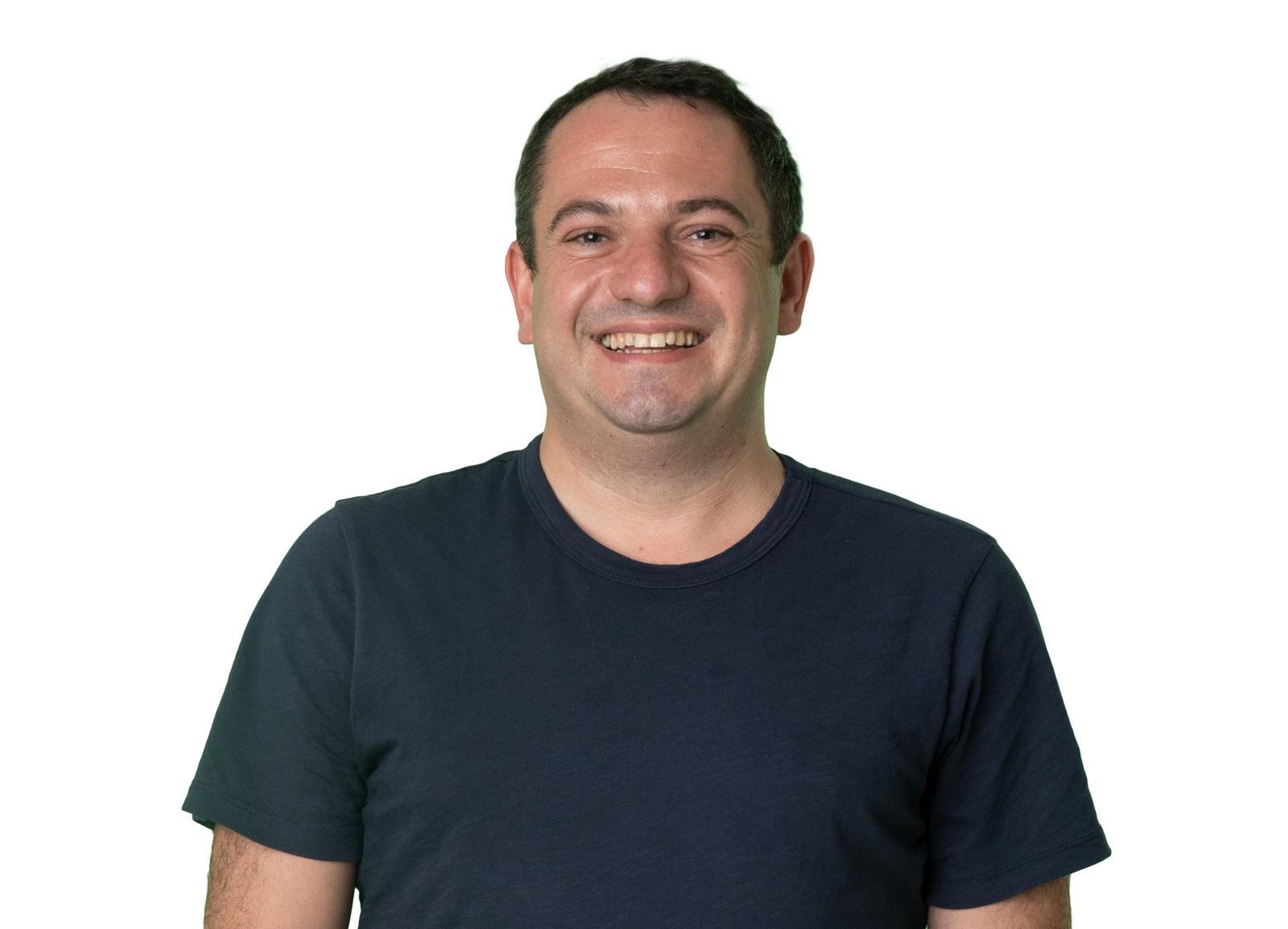 Danny Shteinberg smiling against a white background