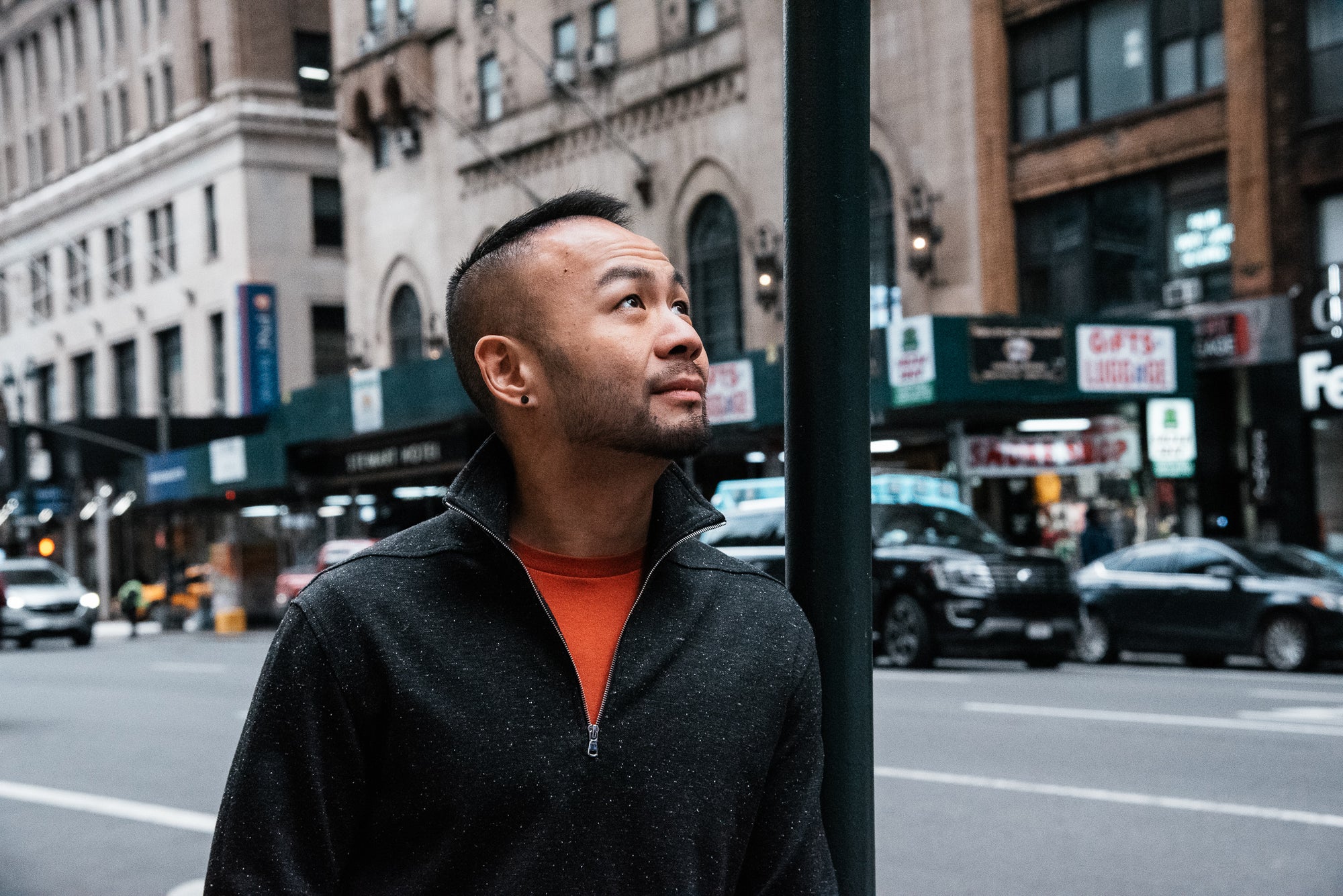 Danny Taing in a dark coat on a city street