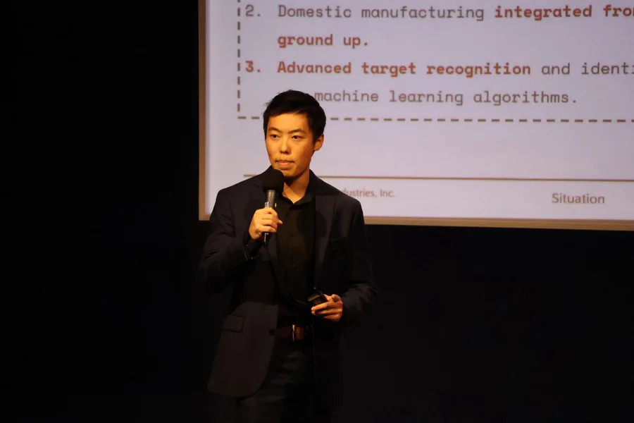 Darcy Zhang presenting Greypoint Industries onstage at the 2025 UBC Venture Showcase