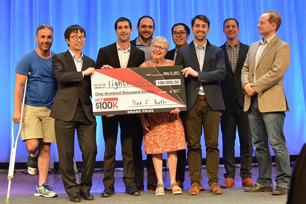 The Lightmatter team and organizers holding the MIT 100K grand-prize check in 2017