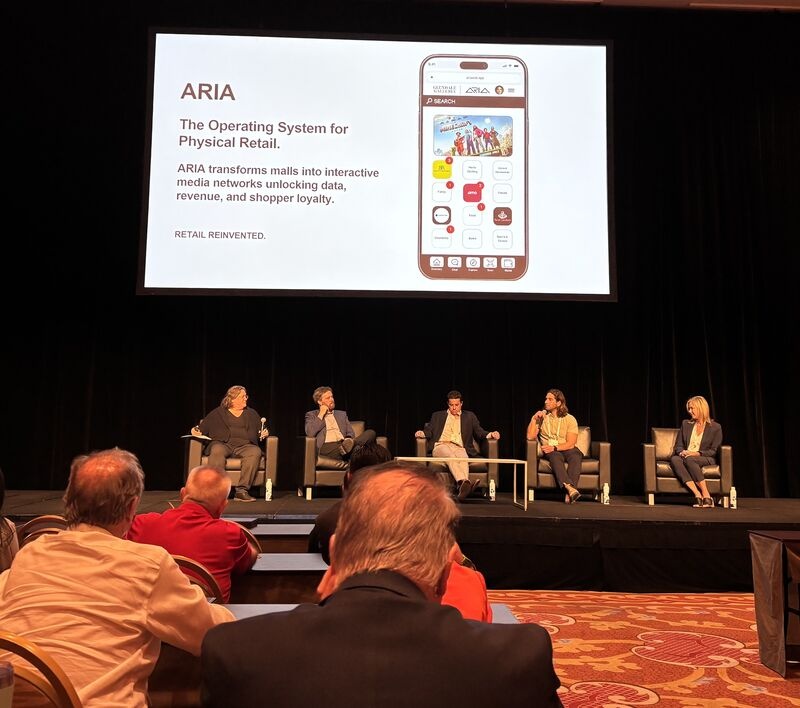 ICSC panel beneath a presentation slide showing ARIA’s mobile shopping interface