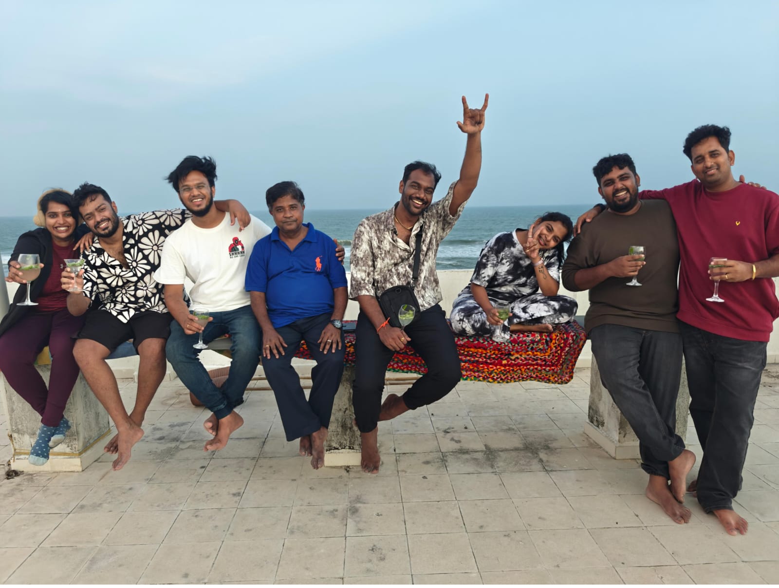 Eight people gathered beside the sea in a photograph published in Datum’s company gallery