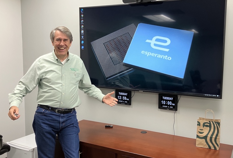 Dave Ditzel standing beside a display showing Esperanto’s chip package during a 2022 office interview