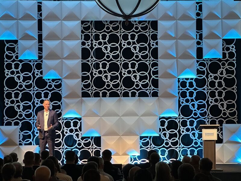 Dave Huml presenting onstage to Tennant employees at the Americas Sales Meeting