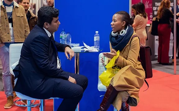 A conversation at the blue Online Account Filing exhibition stand