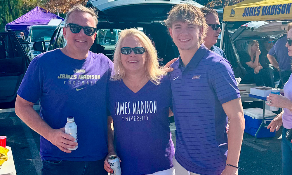 Dave Rennyson with his wife Alisa and their son at a James Madison University game-day gathering