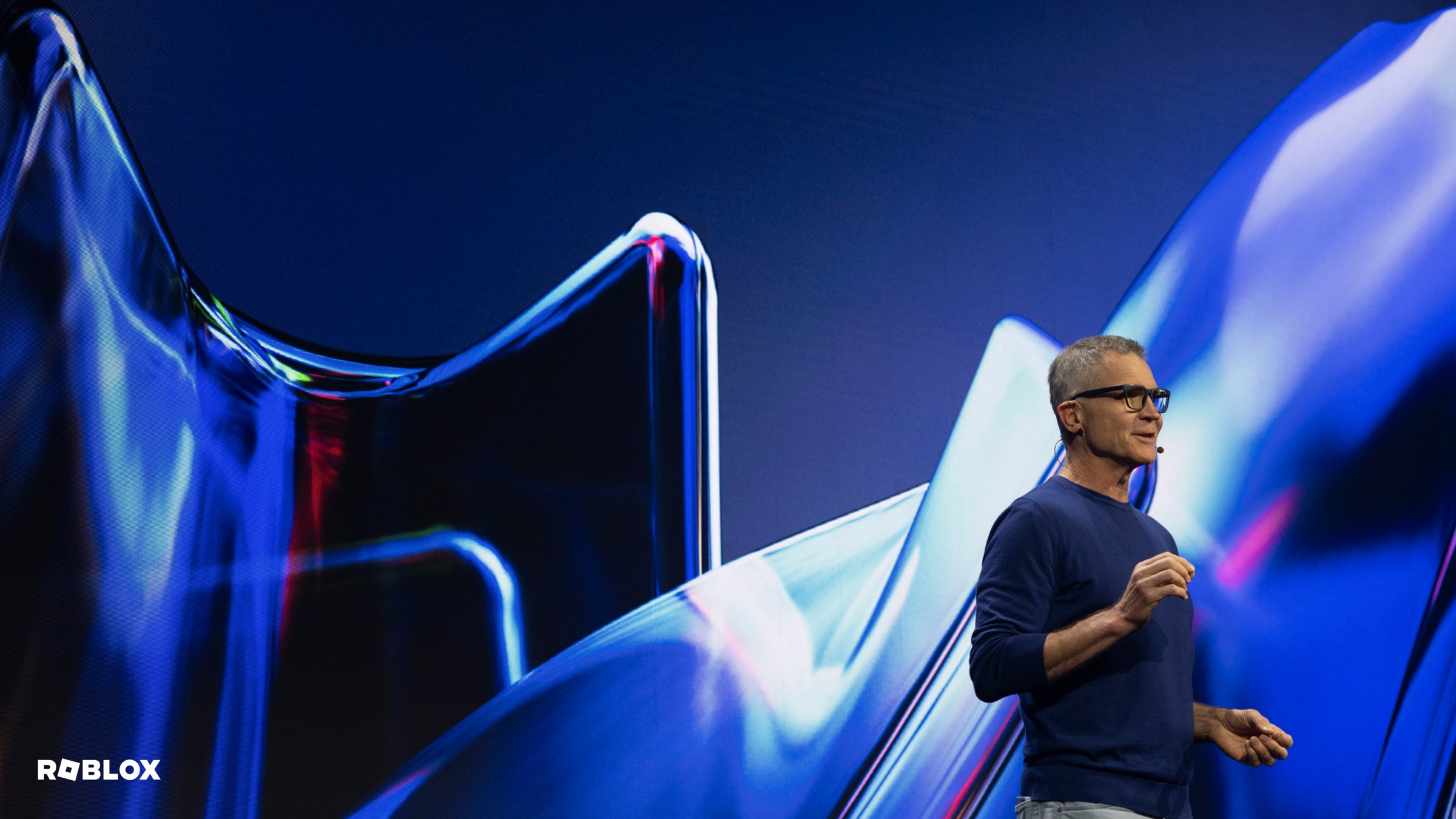 David Baszucki speaking onstage at the Roblox Developers Conference