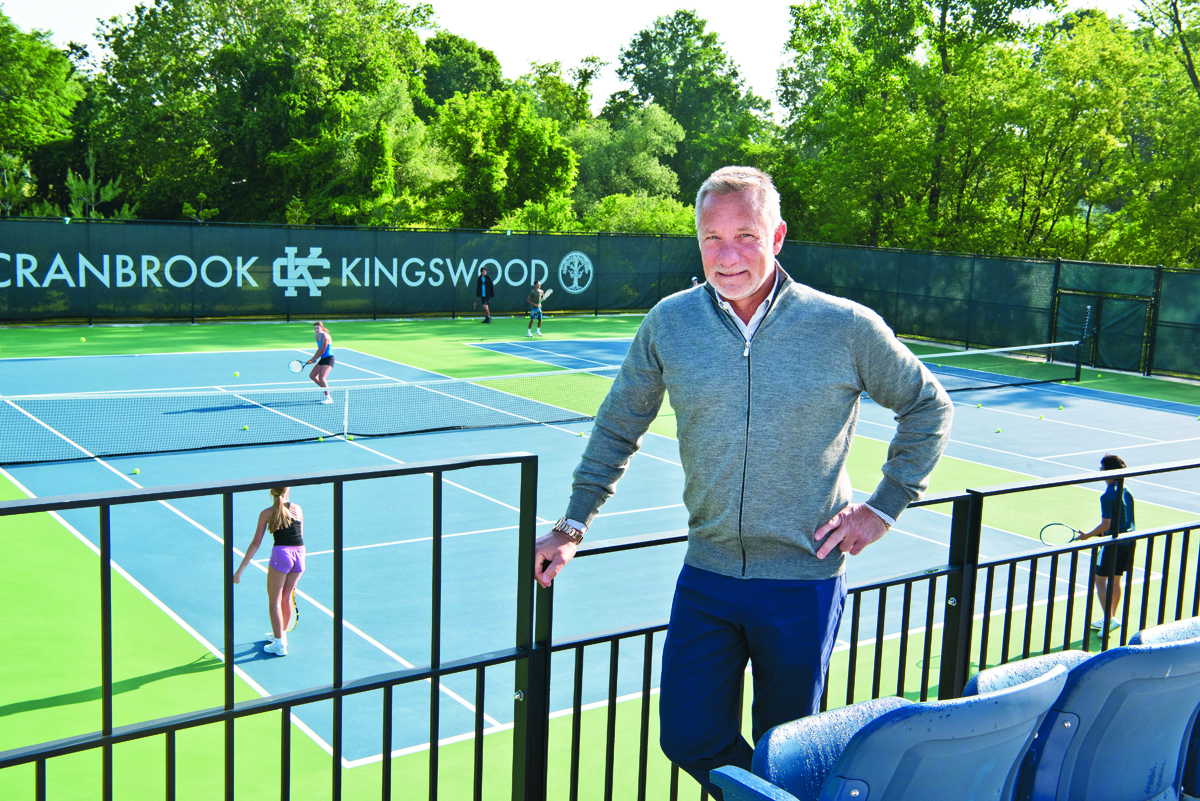 David DeMuth beside the tennis courts at Cranbrook Kingswood