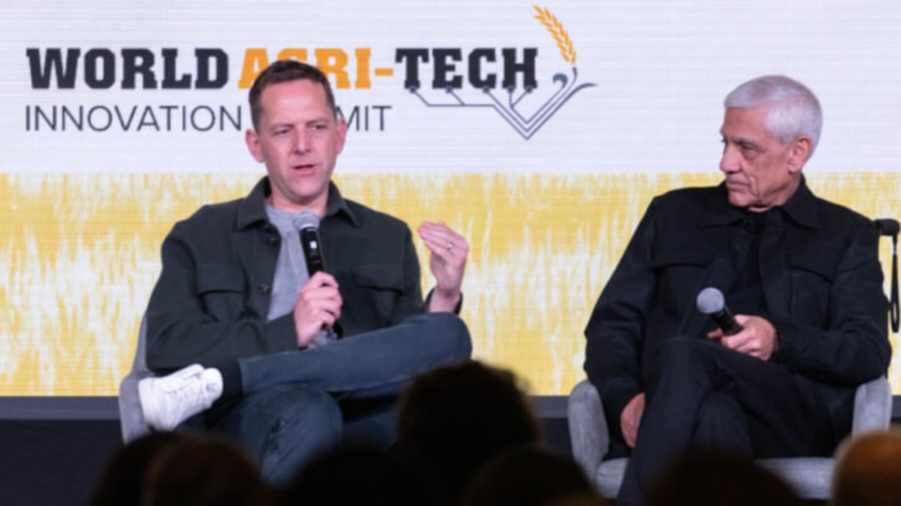 David Friedberg, seated at left with a microphone, speaks at the World Agri-Tech Innovation Summit
