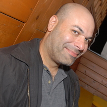 David H. Lasker smiling in a separate professional photograph