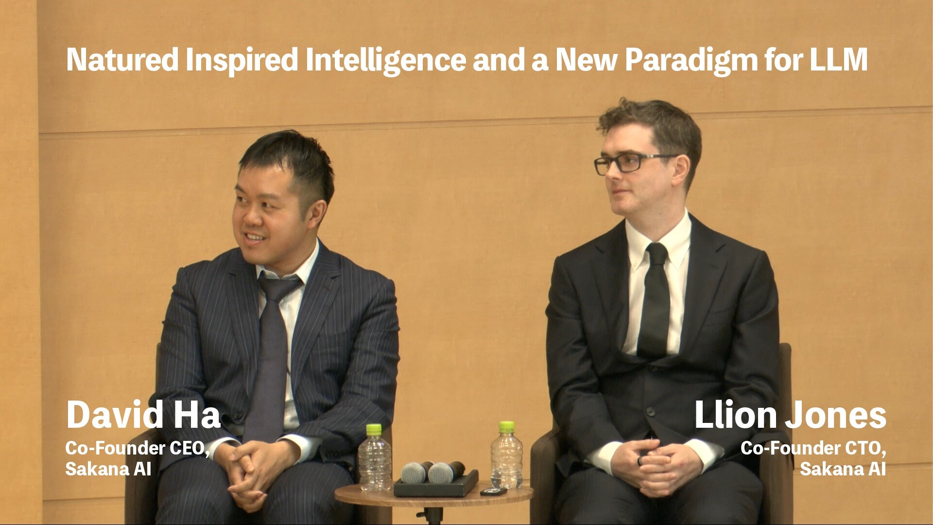 David Ha and Llion Jones speaking onstage at NTT R&D Forum 2023