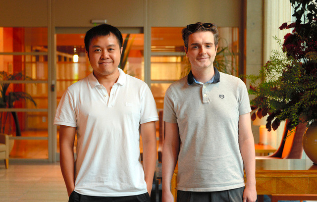David Ha and Llion Jones standing together in a Tokyo lobby