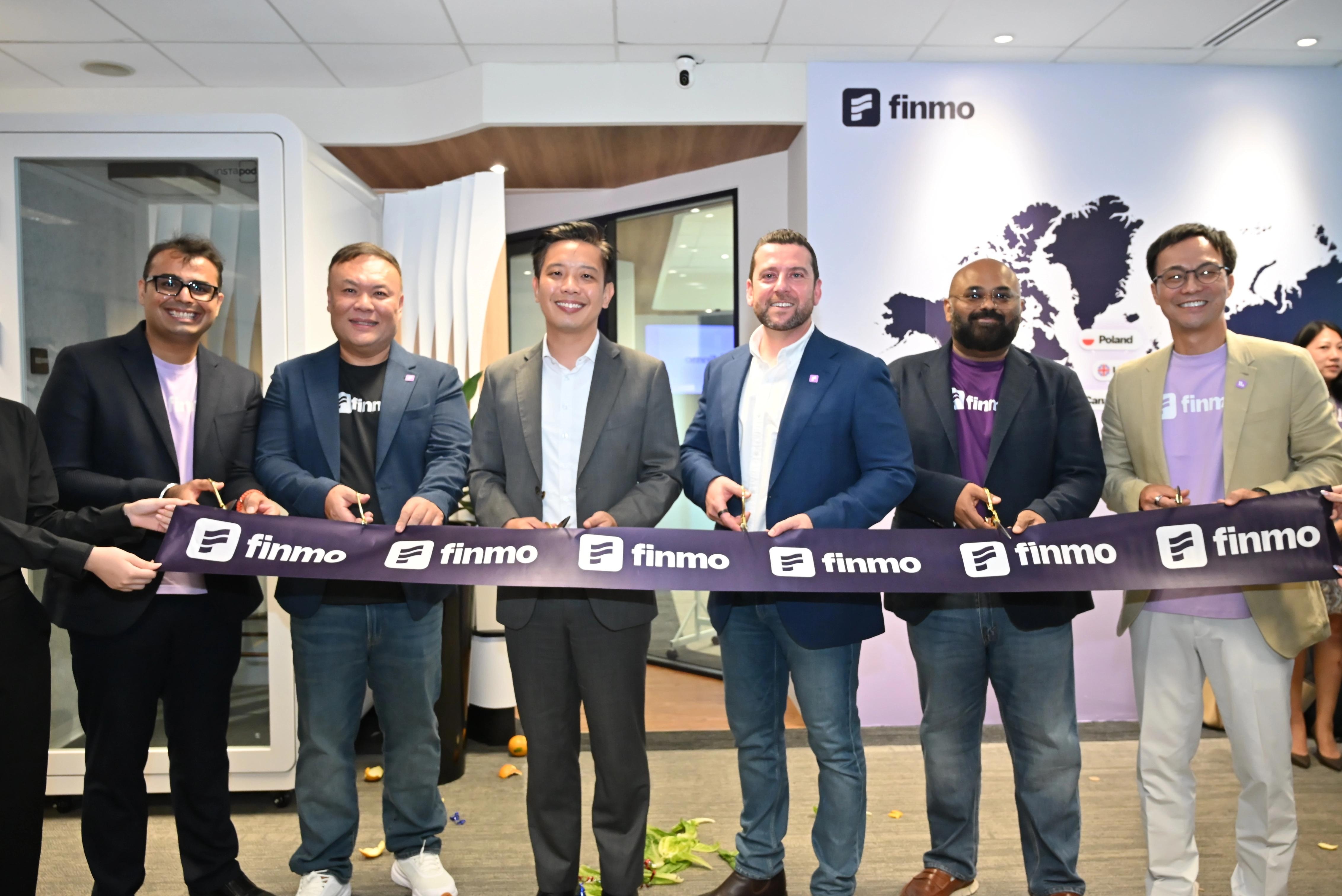 David Hanna, fourth from left, joins Finmo co-founders and Alvin Tan to cut the ribbon at the Singapore headquarters opening.