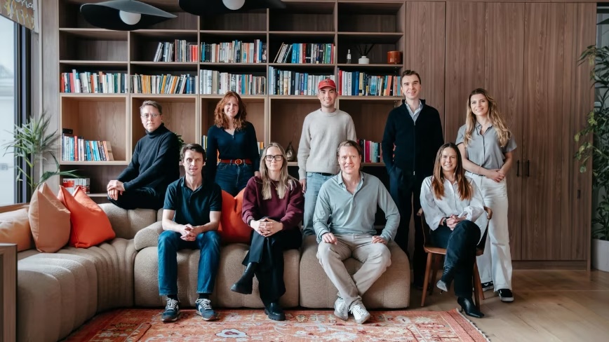 David Helgason and colleagues in a Transition Ventures team photograph, gathered beside a sofa and bookshelves.