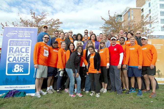 The Acumen Solutions team gathered outdoors at the 2012 Race for a Cause