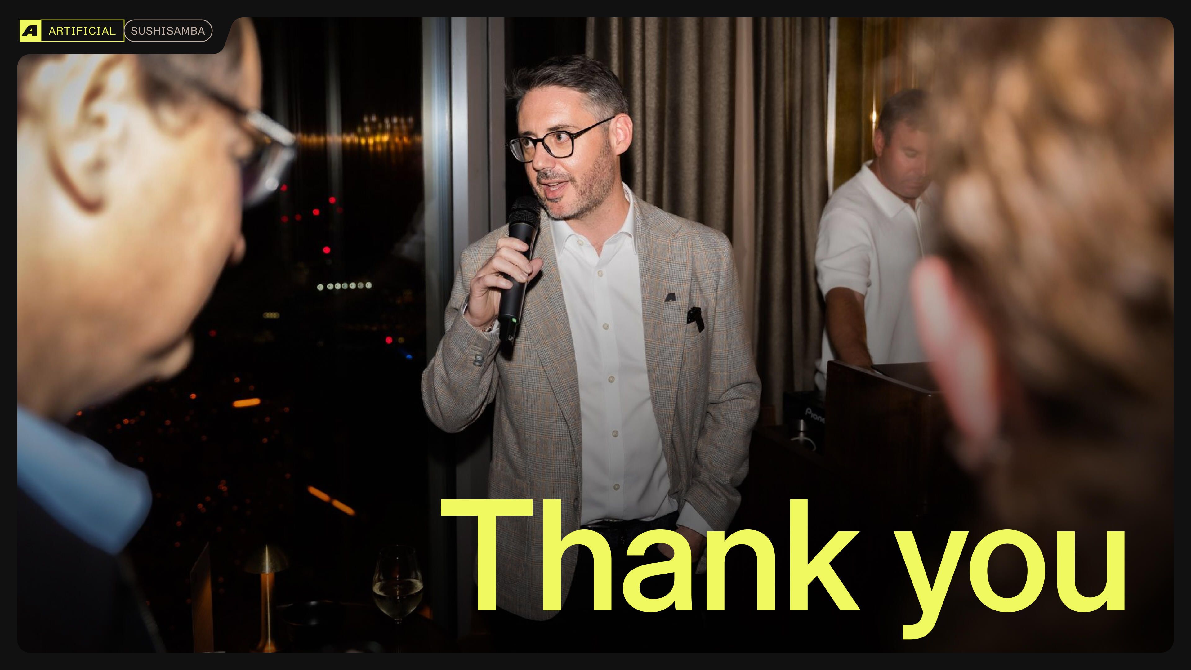 David King speaking into a microphone among guests at Artificial’s SUSHISAMBA gathering