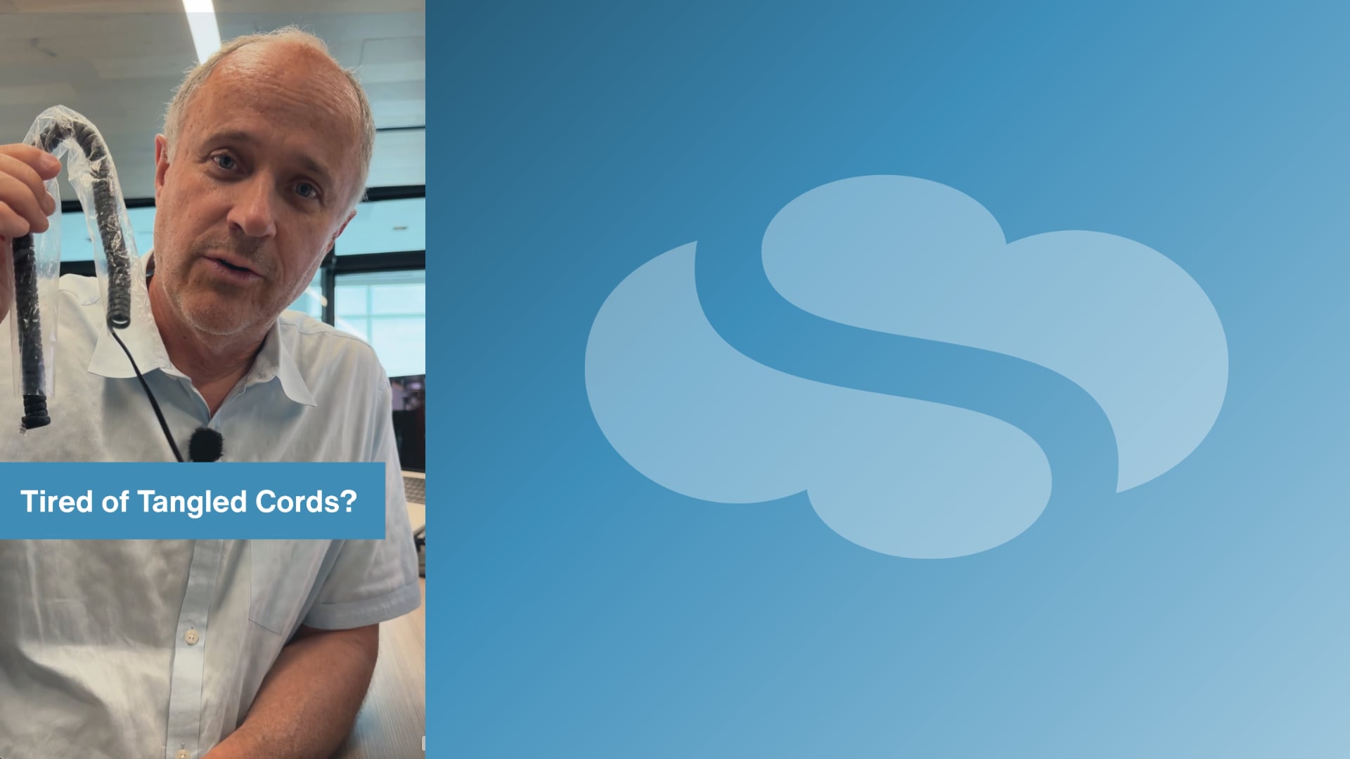 David Leidy holding a tangled handset cord in a SpectrumVoIP video