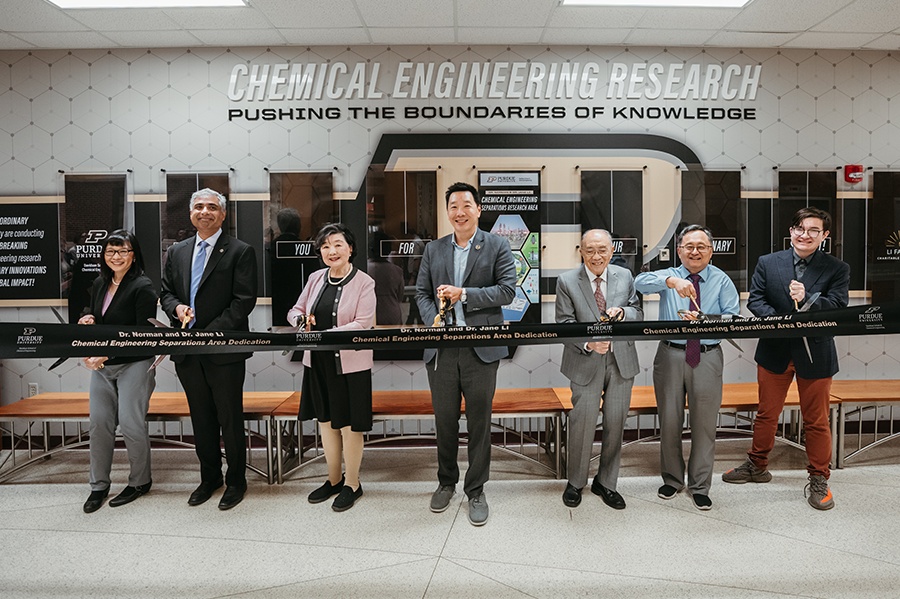 David Li, center, joins family and Purdue colleagues cutting a ribbon at the separations research area dedication.