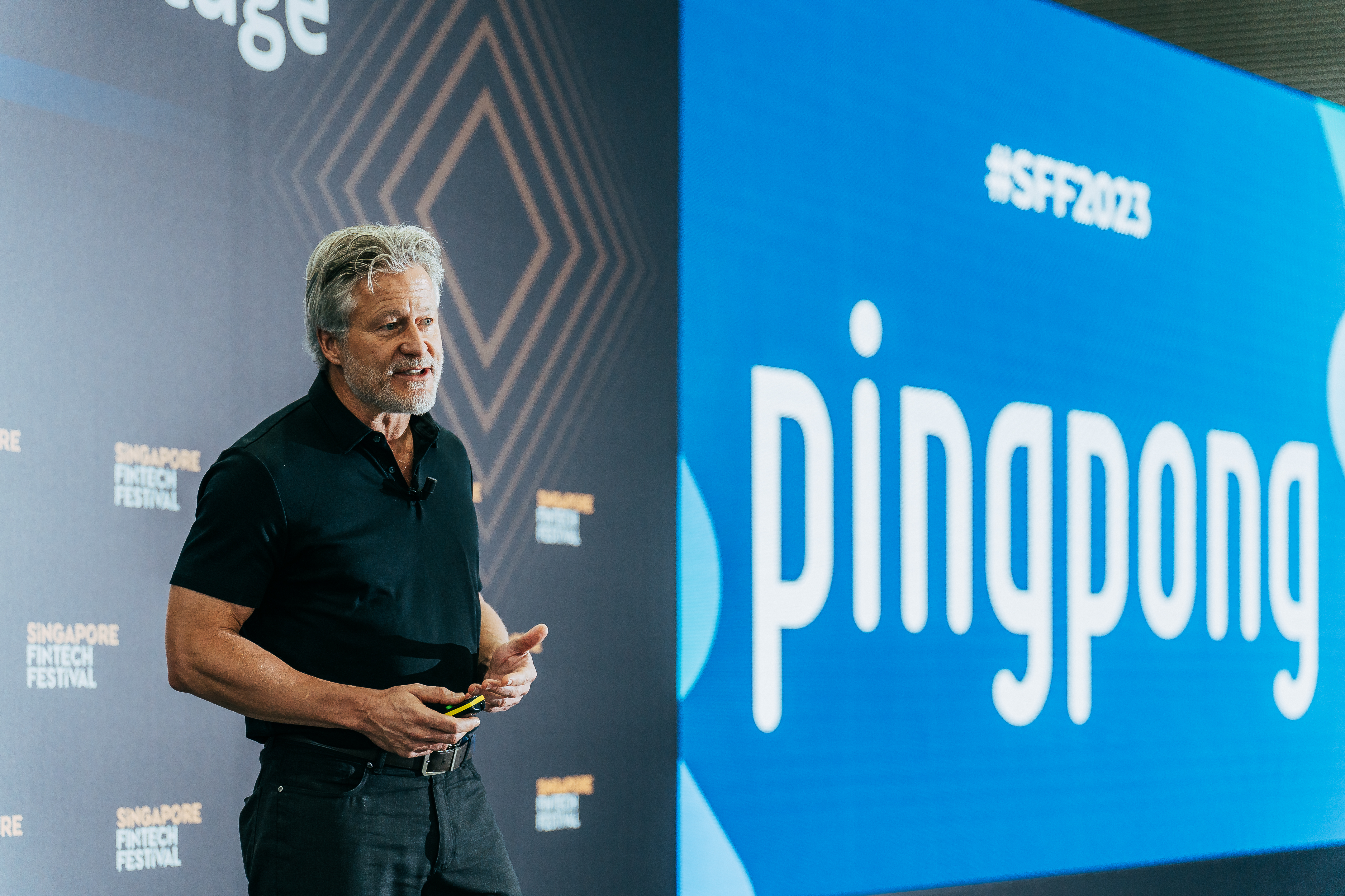 David Messenger speaking on stage at Singapore FinTech Festival 2023