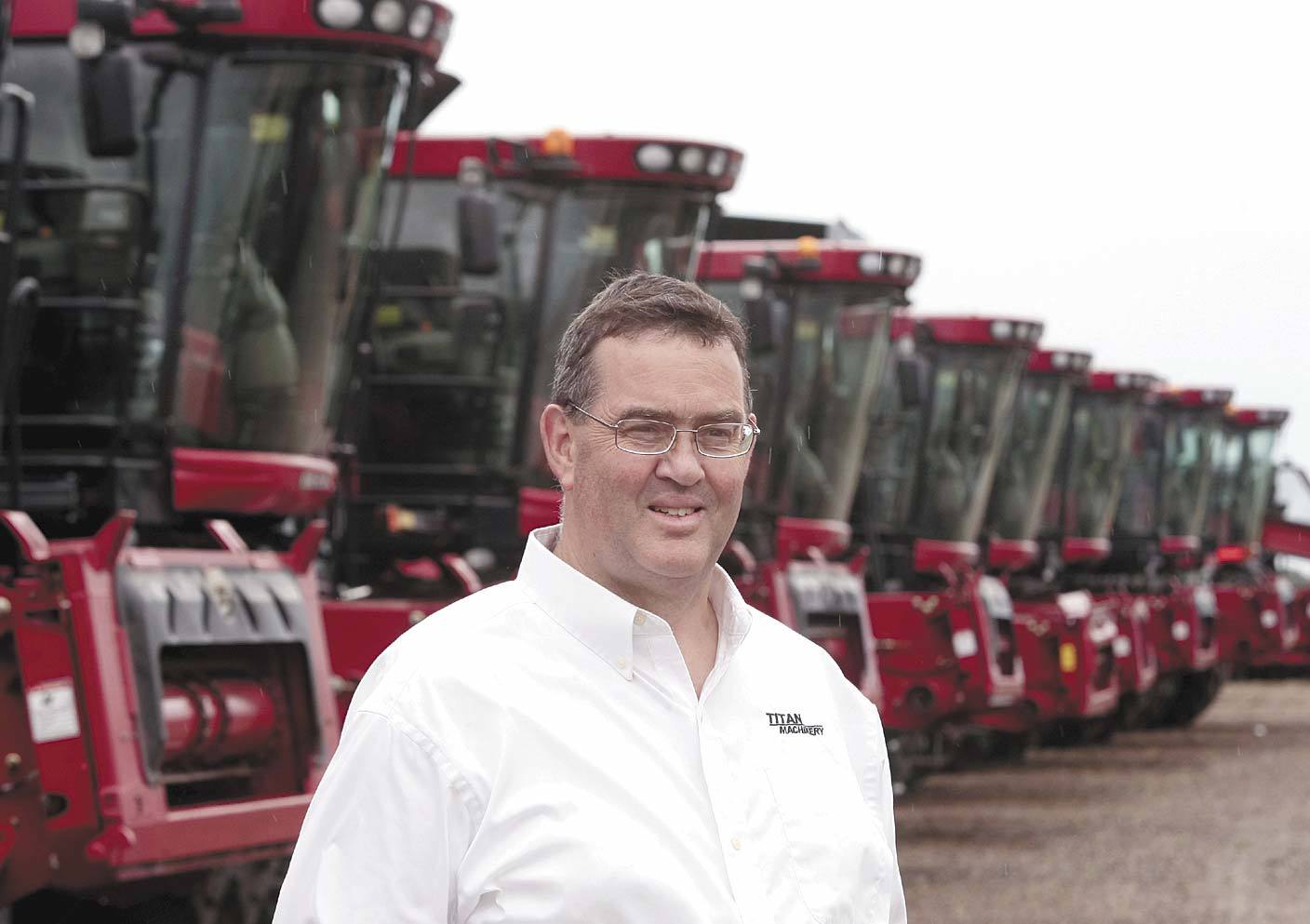 David Meyer beside a row of red Case machines at Titan Machinery’s Moorhead dealership