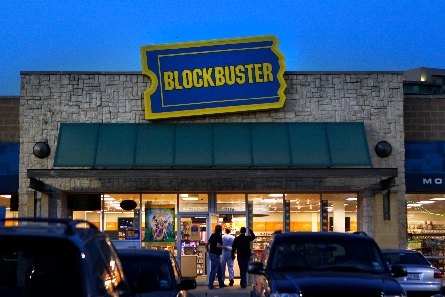 Customers approach a Blockbuster store on McKinney Avenue in Dallas