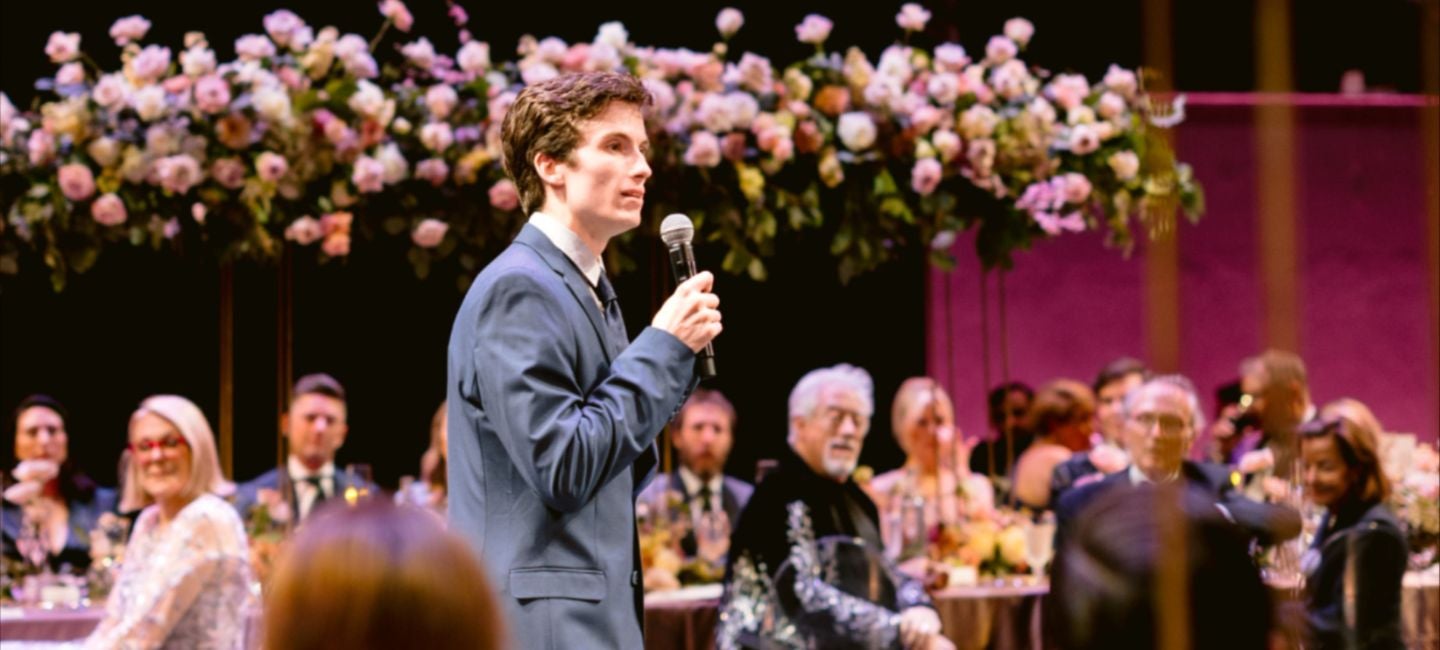 A speaker addresses guests on the stage at Ballet West’s 2025 Spring Soirée