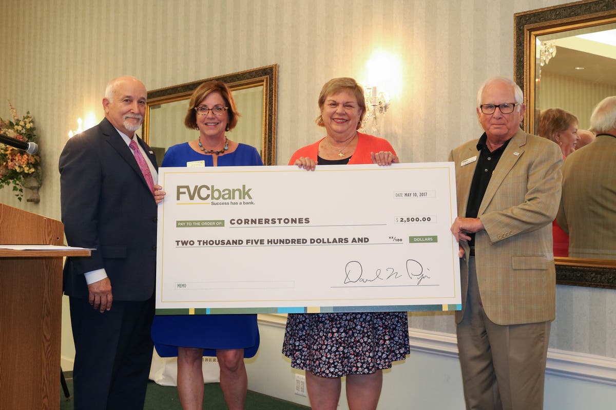 David Pijor, left, with Kerrie Wilson, Susan Jones and L. Burwell Gunn, presenting a $2,500 cheque to Cornerstones in May 2017.