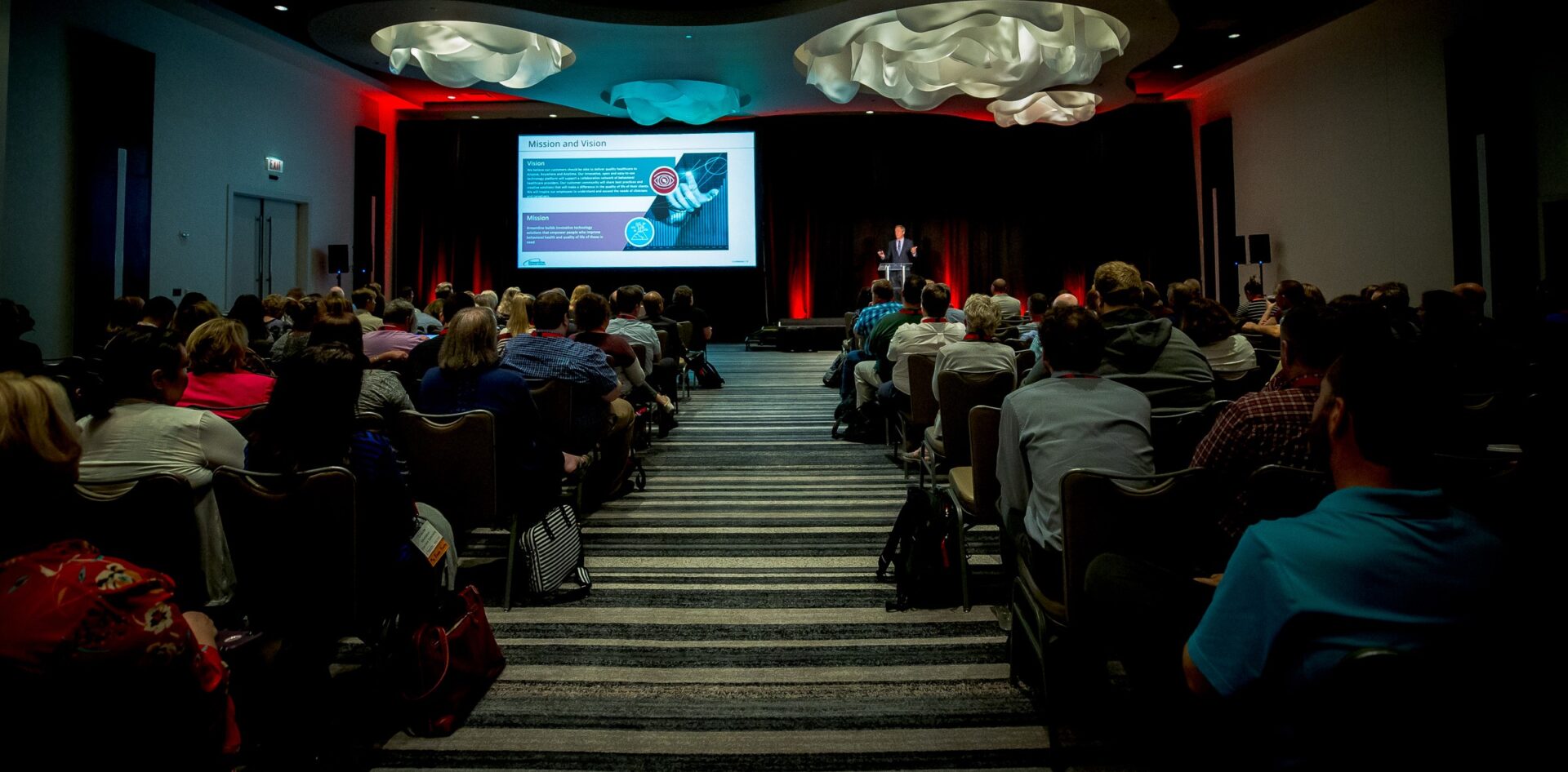 Attendees facing a presentation at a Streamline community conference