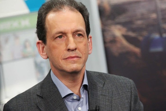 David Schlanger in a gray jacket and blue shirt