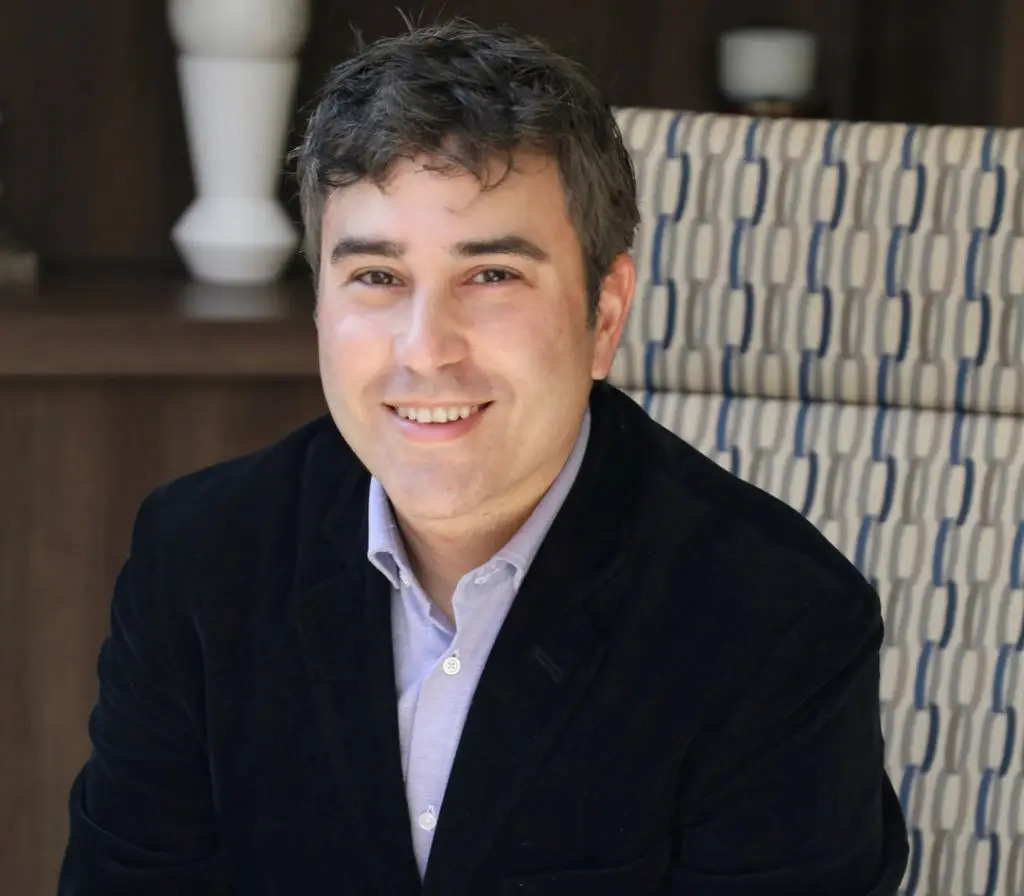 David Slater seated in a dark jacket and light shirt