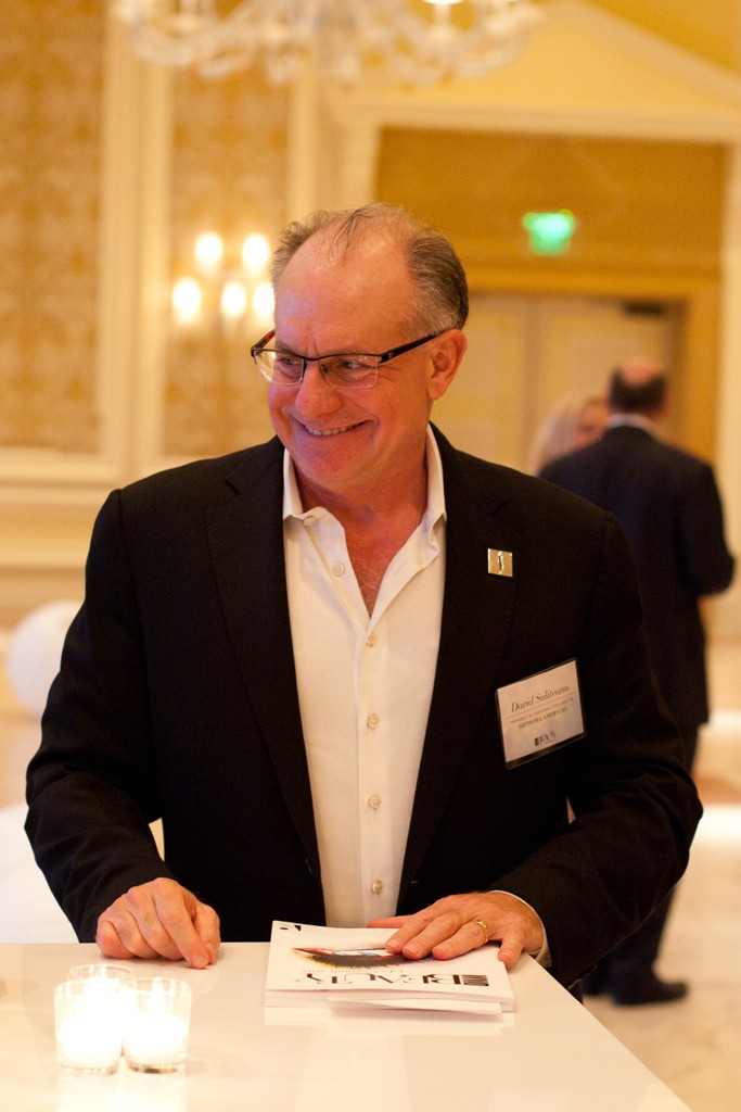 David Suliteanu smiling at a table during the 2012 WWD Beauty CEO Summit