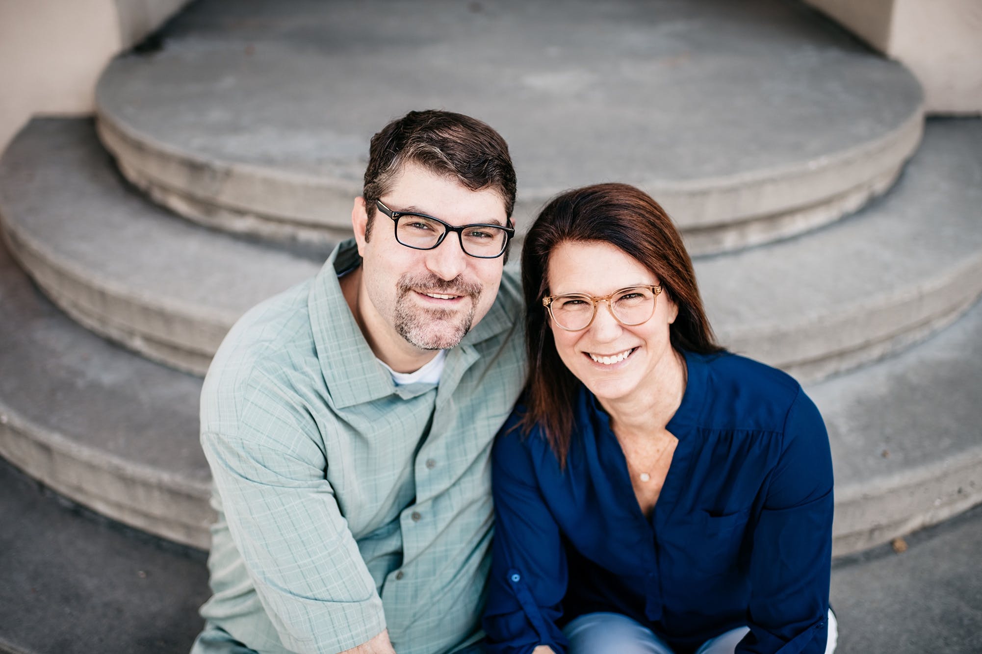 David Weiss and Ann Crady Weiss, the co-founders of Hatch, seated together on stone steps