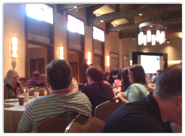 Attendees seated around tables at the 2011 e-MDs annual meeting